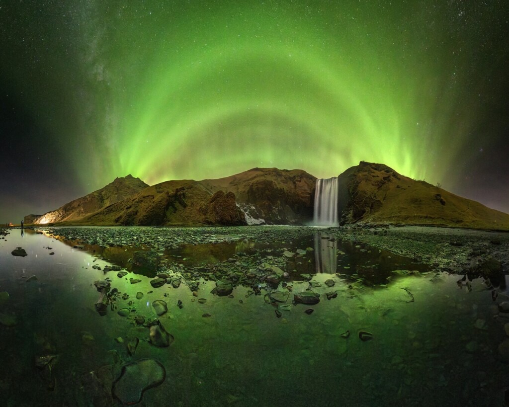 “A Cathedral of Green Light Rising Over Skógafoss” - Victor Lima